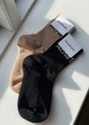 Acne Studios' FN-UX-ACCS000078 - Zwart/Ivoor. Koop hier sokken/kousen.